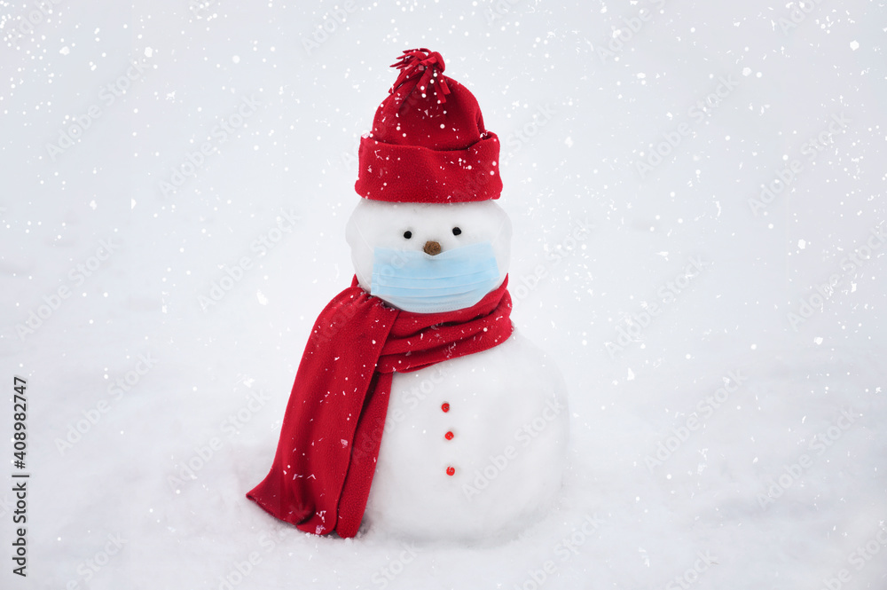 Snowman wearing a face mask, winter hat. scarf on a white background