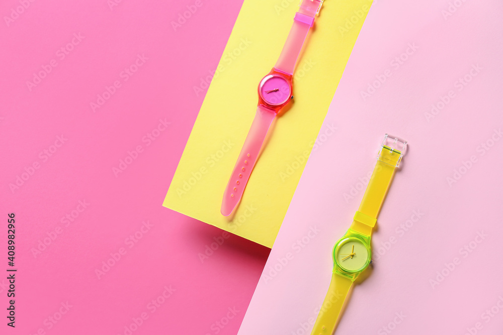 Stylish wrist watches on colorful background Stylish wrist watches on colorful background