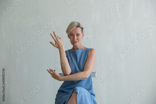 mid adult woman posing emotion in studio photo