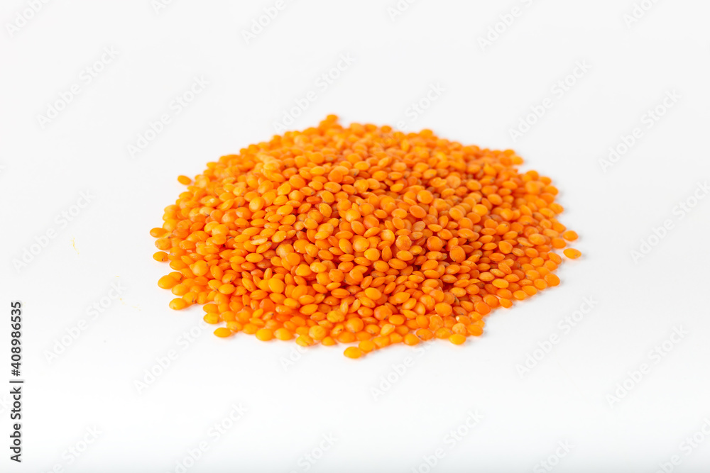 Red lentils on white background. Red lentils on white background.