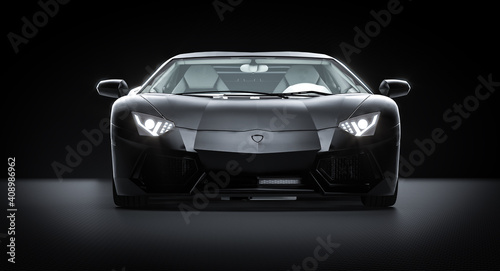 black sports car on carbon fiber background. © tiero