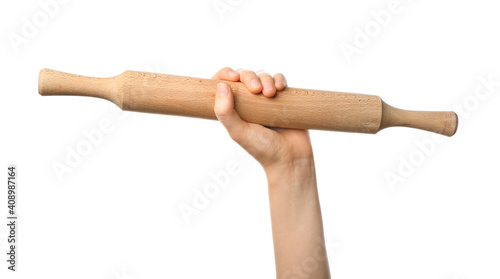 Female hand with rolling pin on white background photo