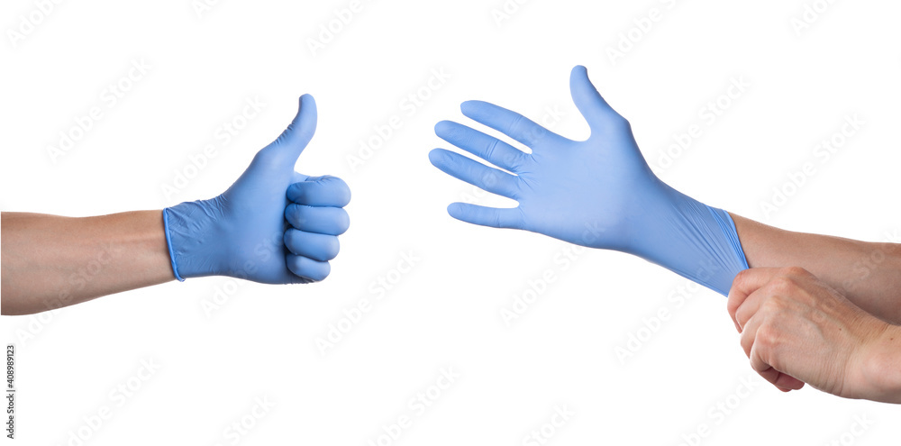 Doctor putting on sterile gloves isolated on white Doctor putting on sterile gloves isolated on white