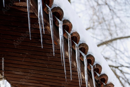 Wintertime icicles hanging from roof