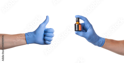 Doctor putting on sterile gloves isolated on white