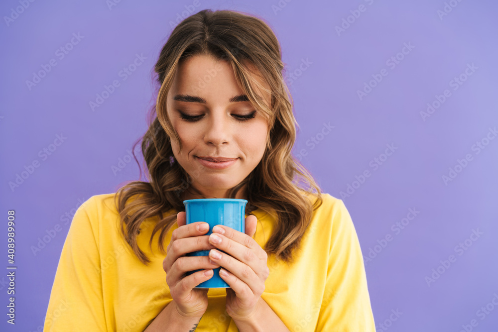 Pleased beautiful nice girl smiling while drinking coffee Pleased beautiful nice girl smiling while drinking coffee