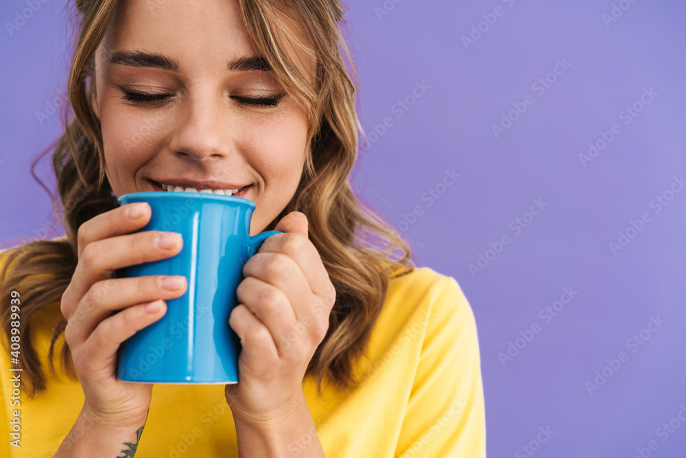 Happy beautiful nice girl smiling while drinking coffee Happy beautiful nice girl smiling while drinking coffee