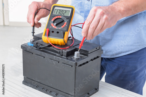 Fototapeta Checking car battery