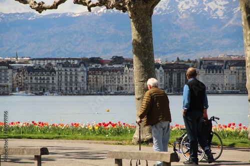 old couple waking by the lake in Switzerland