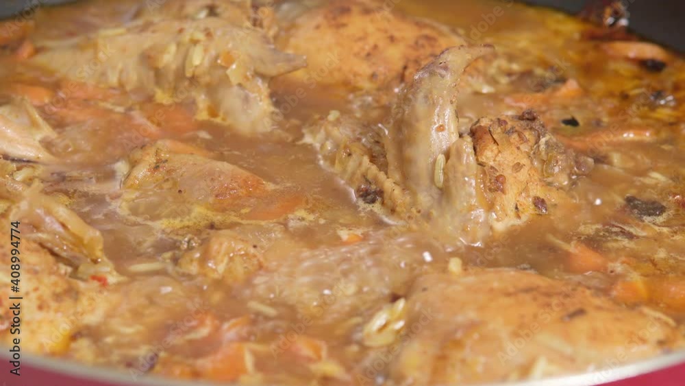 chicken stew with vegetables and rice close-up. cooking food chicken stew with vegetables and rice close-up. cooking food