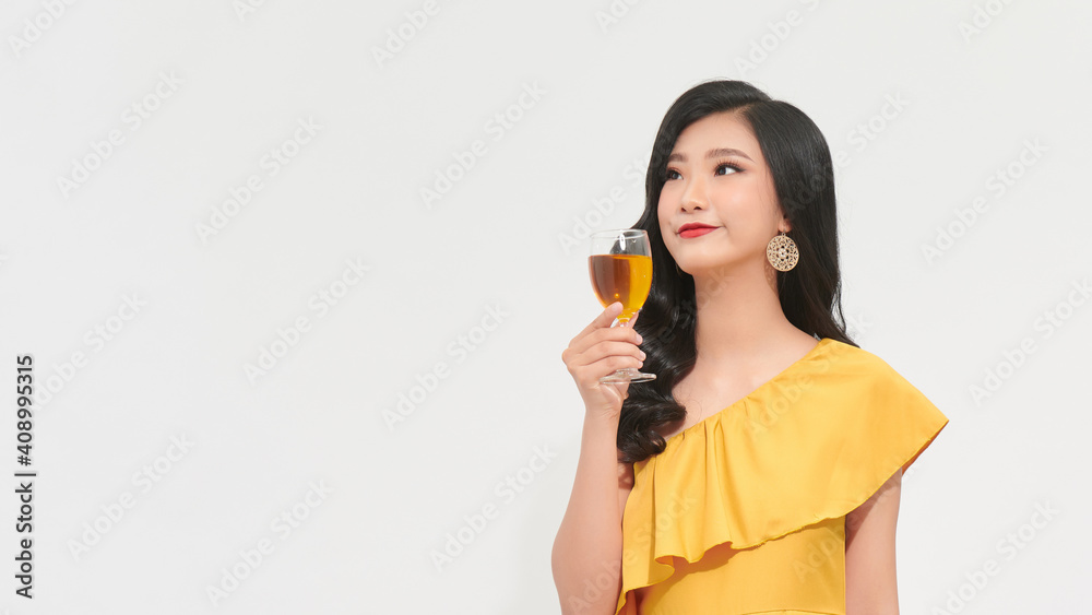 Excited girl waving her hair while dancing at party. Wonderful lady drinking champagne at event. Excited girl waving her hair while dancing at party. Wonderful lady drinking champagne at event.