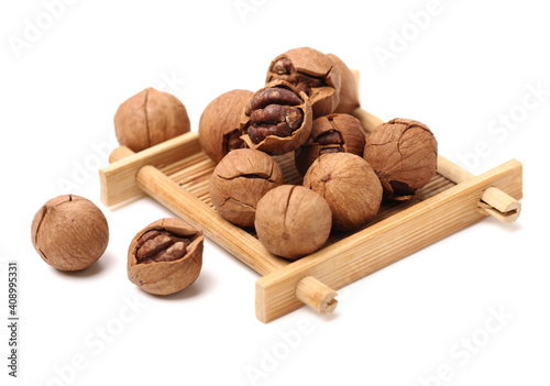 shagbark hickory nuts on white background photo