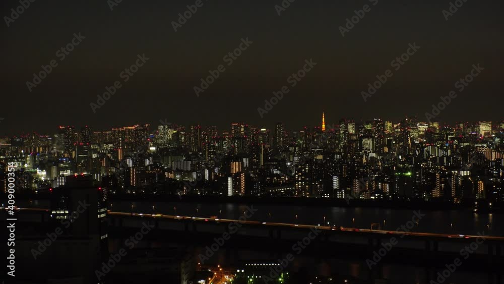 TOKYO, JAPAN : Aerial high angle sunset CITYSCAPE of TOKYO and Mount Fuji. View of river and buildings at central downtown area. Japanese urban metropolis concept. Wide time lapse shot dusk to night. TOKYO, JAPAN : Aerial high angle sunset CITYSCAPE of TOKYO and Mount Fuji. View of river and buildings at central downtown area. Japanese urban metropolis concept. Wide time lapse shot dusk to night.