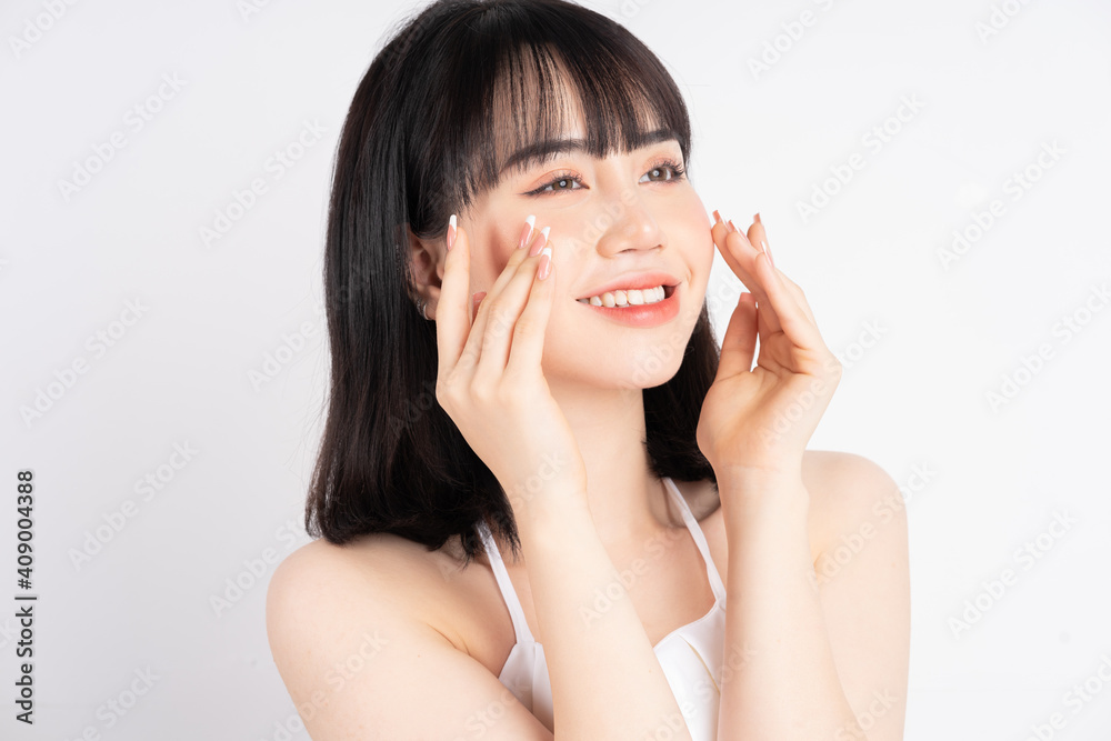 Attractive young Asian woman with fresh skin. Face care, facial treatment, , woman beauty skin isolated on white background. cosmetology, beauty skin and cosmetic concept Attractive young Asian woman with fresh skin. Face care, facial treatment, , woman beauty skin isolated on white background. cosmetology, beauty skin and cosmetic concept