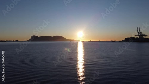  A sunrise from a drone view of the gibraltar rock from the bay of Algeciras, south of spain.