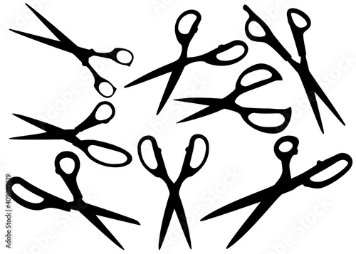 Opened tailors scissors in a set.