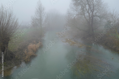 Misty river landscapes of the River Tove in England on a winter's day.  photo