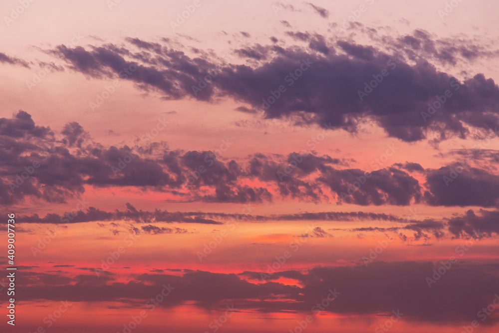 Dramatic soft sunrise, sunset, pink violet orange red sky with clouds background texture	
