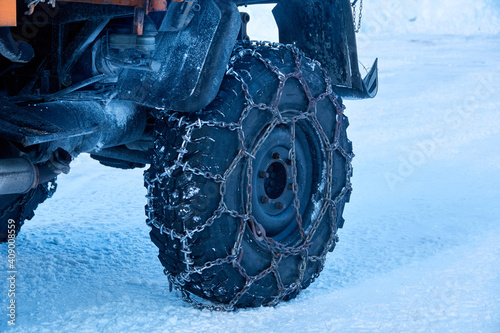 closeup of the truck tired with snow chains