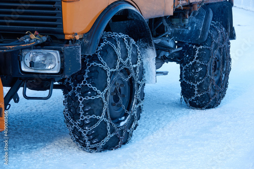 closeup of the truck tireds with snow chains