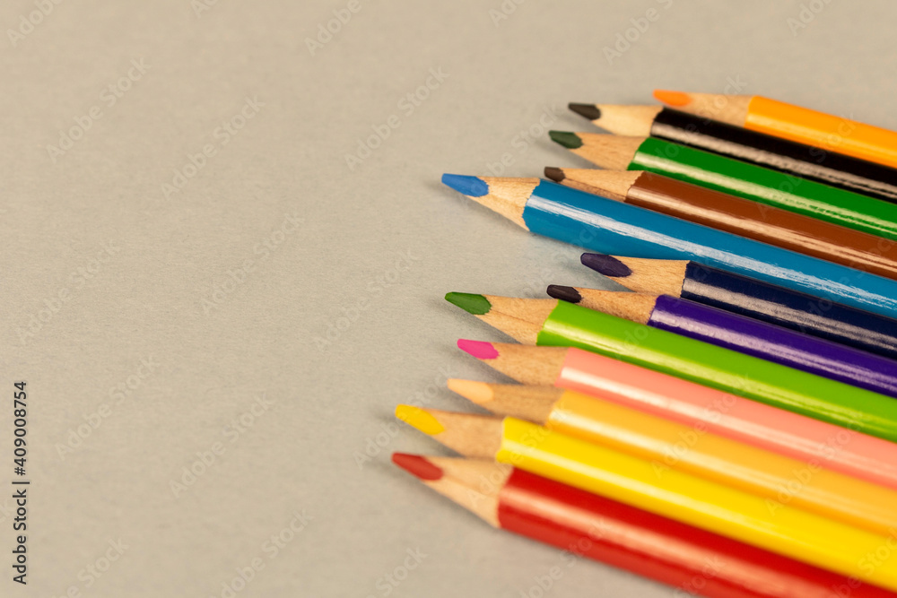 Colored pencils on a light background . Close up. Selective focus. Colored pencils on a light background . Close up. Selective focus.