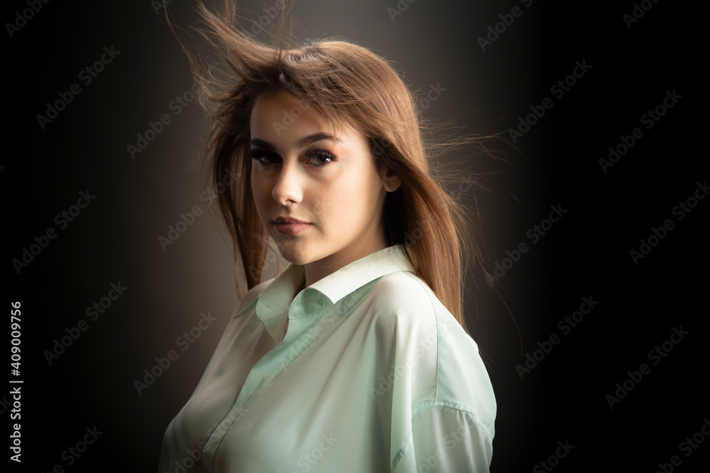 Young woman looking at camera isolated on black background Young woman looking at camera isolated on black background