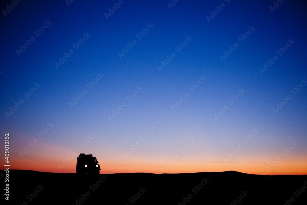 Fototapeta premium Four Wheel Drive silhouette in the desert.