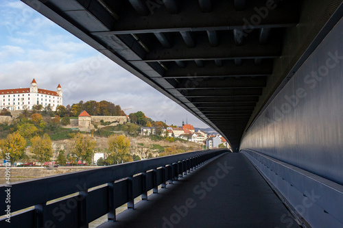 the view from the bridge to Bratislava Castle is built on the slopes of the Carpathians near the banks of the Danube.