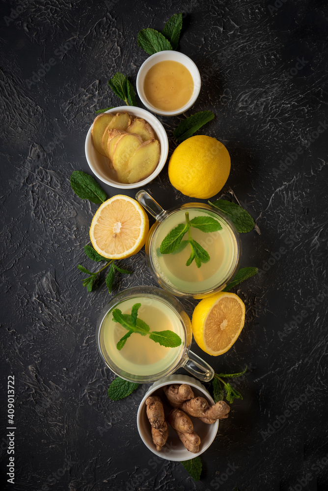Ginger tea with mint, lemon and honey on concrete background. Top view Ginger tea with mint, lemon and honey on concrete background. Top view