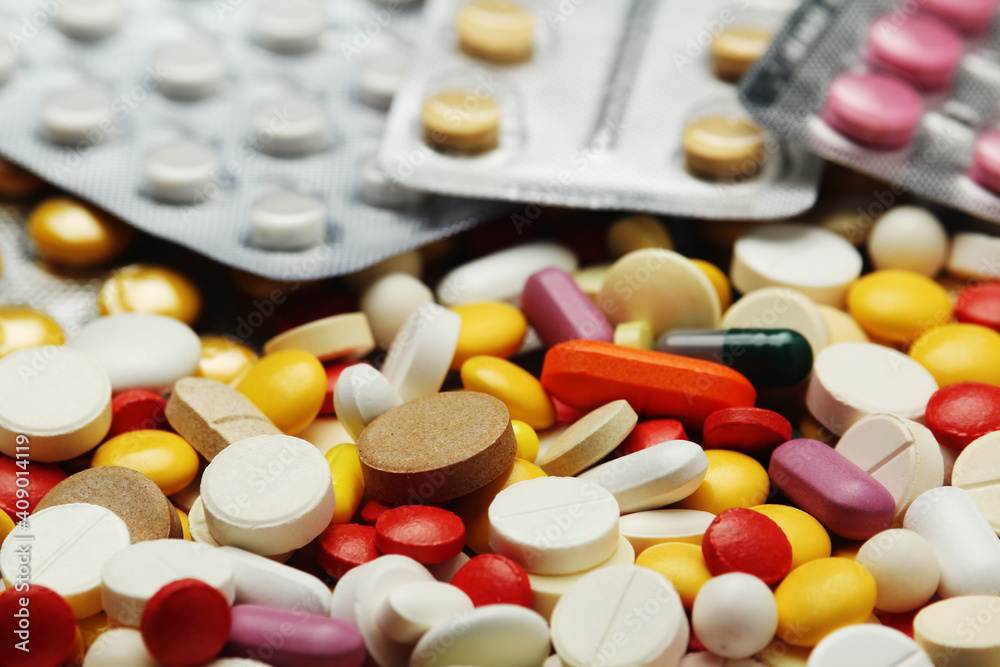 Different colorful tablets at white background Different colorful tablets at white background