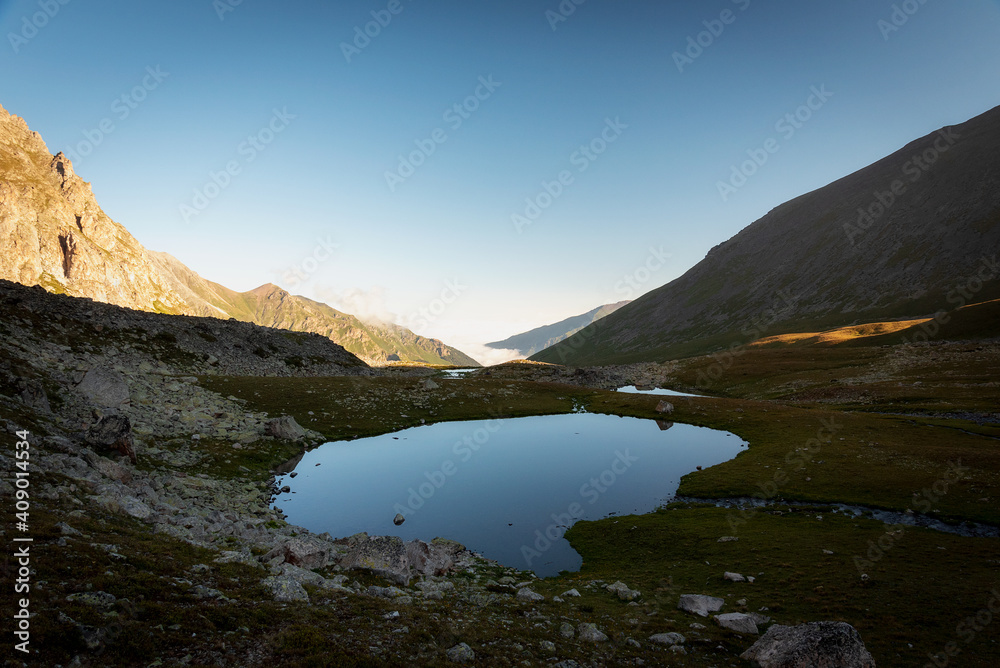 alpine lake in the summer in the mountains of the Teberda Nature Reserve in the Karachay-Cherkess Republic