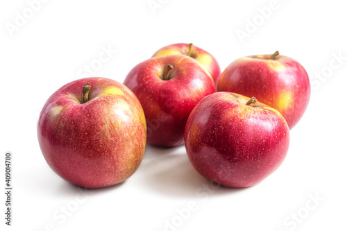 Ripe red-yellow apples on a light background