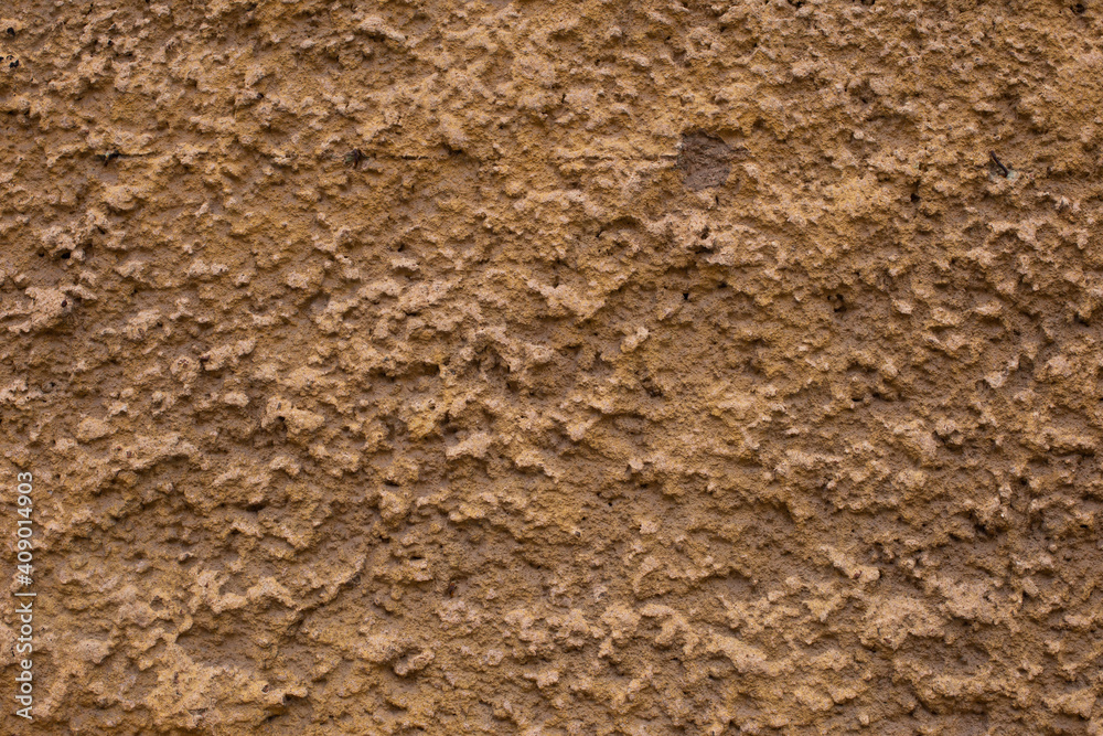 Old retro scrutched yellow brown plaster stucco wall texture Old retro scrutched yellow brown plaster stucco wall texture
