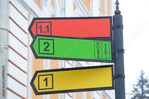 Colored sign on the streets of the metropolis showing the road