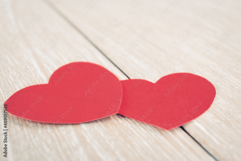 two red Valentines on a wooden background two red Valentines on a wooden background