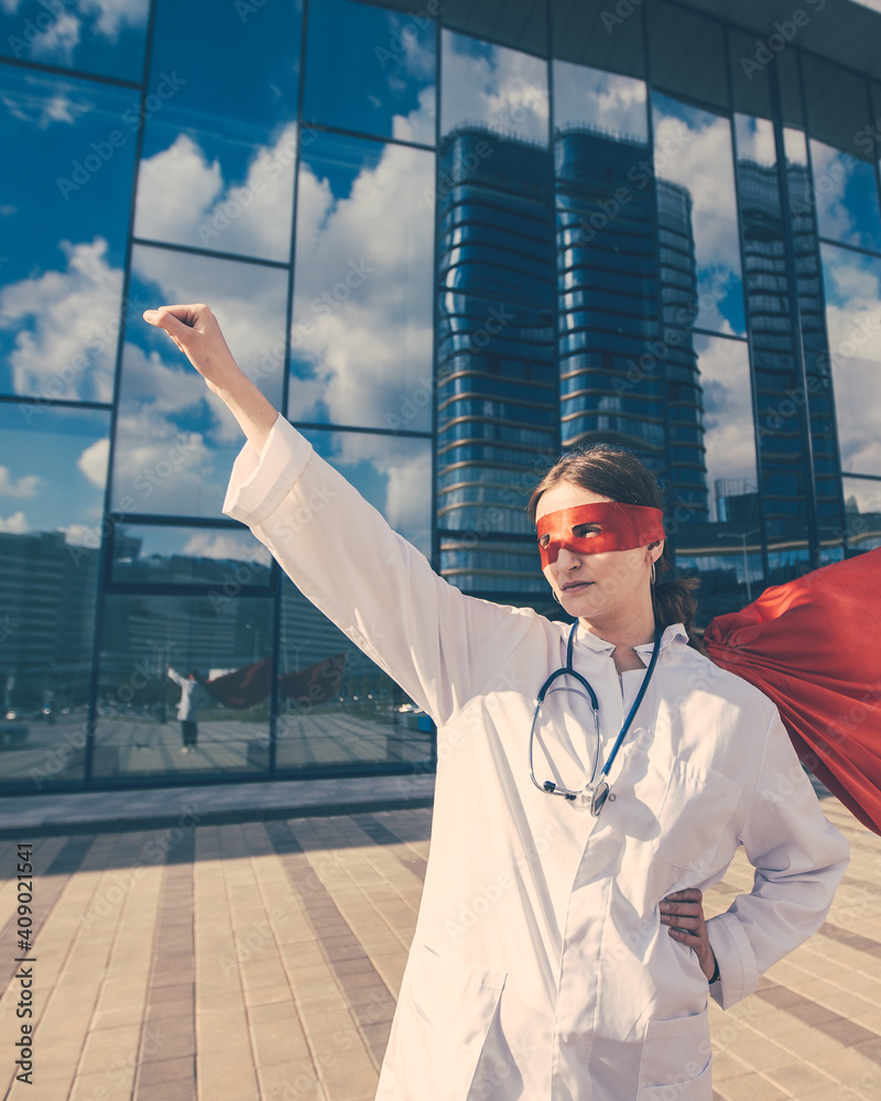 female doctor in a superhero Cape is ready to help .