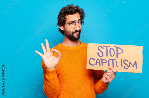 young bearded man stop capitalism concept