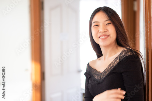 Free Download Smilinng sexy asian women stand posting in livinngroom cozy house - GFXLoad
