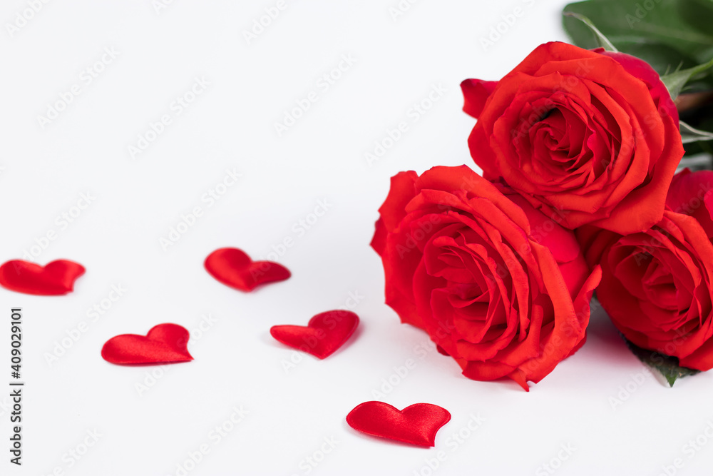 Bouquet of red roses and hearts on a white background. Valentine's day February 14. Place for your text. Bouquet of red roses and hearts on a white background. Valentine's day February 14. Place for your text.
