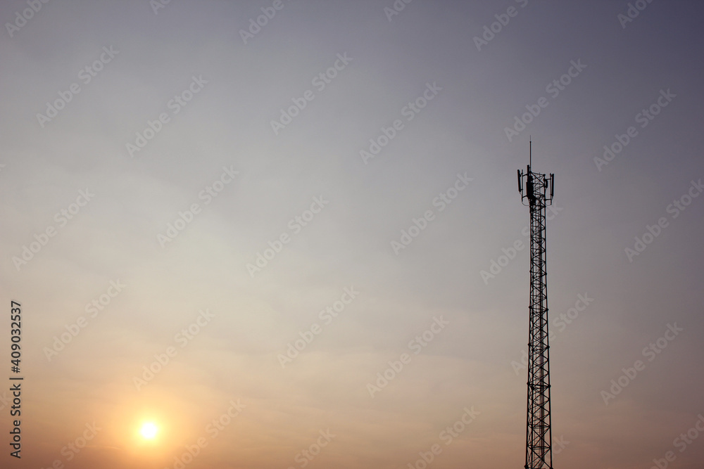 Telecom tower in evening sky. Silhouette phone antenna. Telecom tower in evening sky. Silhouette phone antenna.