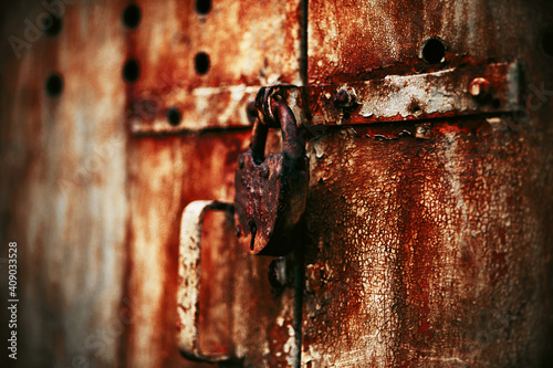 A scary old metal door to an abandoned place that is stained with blood. The aftermath of the murder. The lair of a maniac.