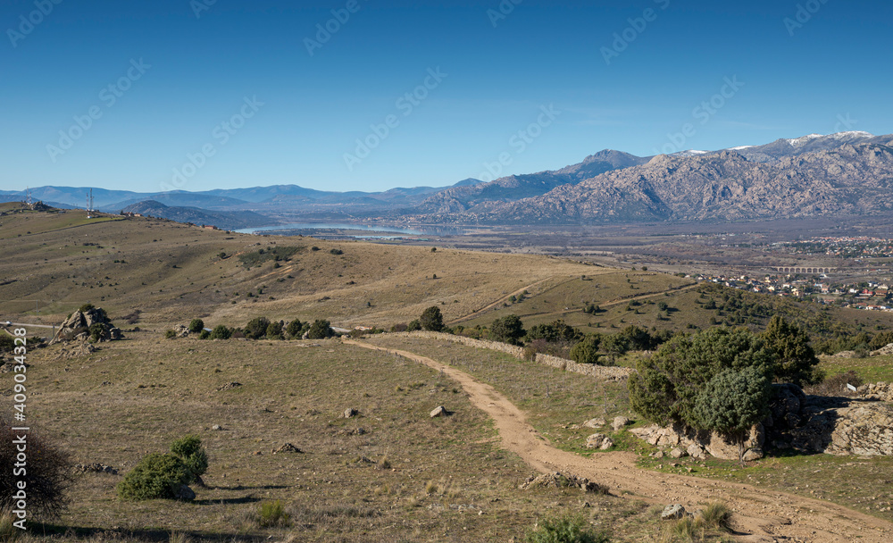 Views of the Santillana Reservoir from the Saint Peter Peak. Photo taken in the municipality of Colmenar Viejo, province of Madrid, Spain Views of the Santillana Reservoir from the Saint Peter Peak. Photo taken in the municipality of Colmenar Viejo, province of Madrid, Spain