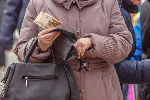 People hold Russian coins and banknotes in their hands. Money close-up.