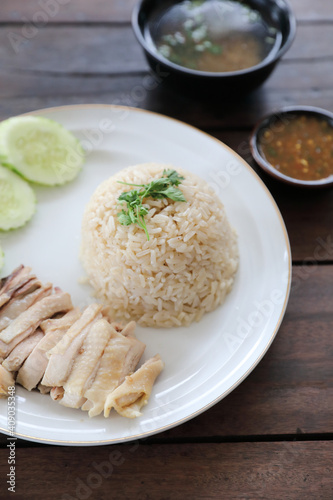 Thai food gourmet steamed chicken with rice khao mun kai in wood background