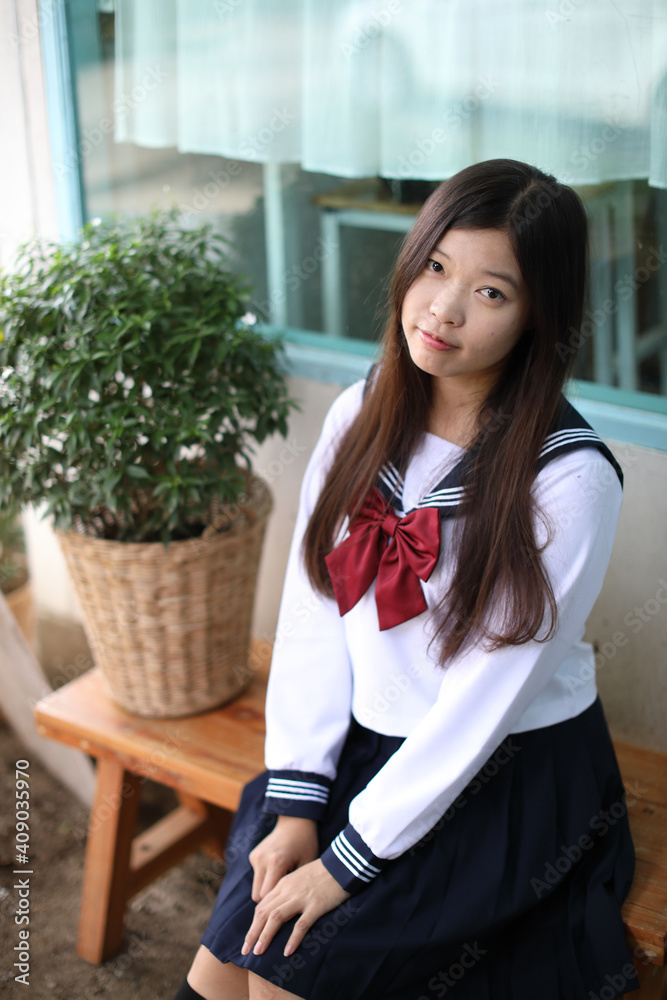 Japanese school girl in local coffee shop Japanese school girl in local coffee shop