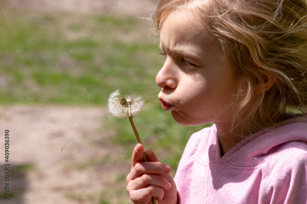 happy little girls blowing seeds from dandelion in lockdown forest happy little girls blowing seeds from dandelion in lockdown forest