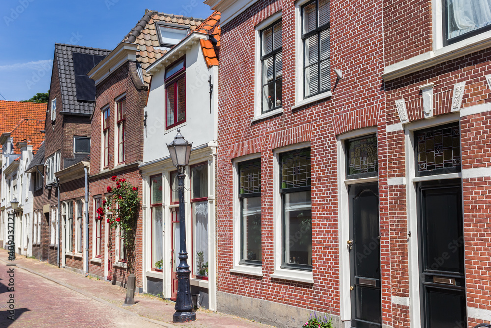 Street with old houses in the historic center of Gouda, Netherlands
