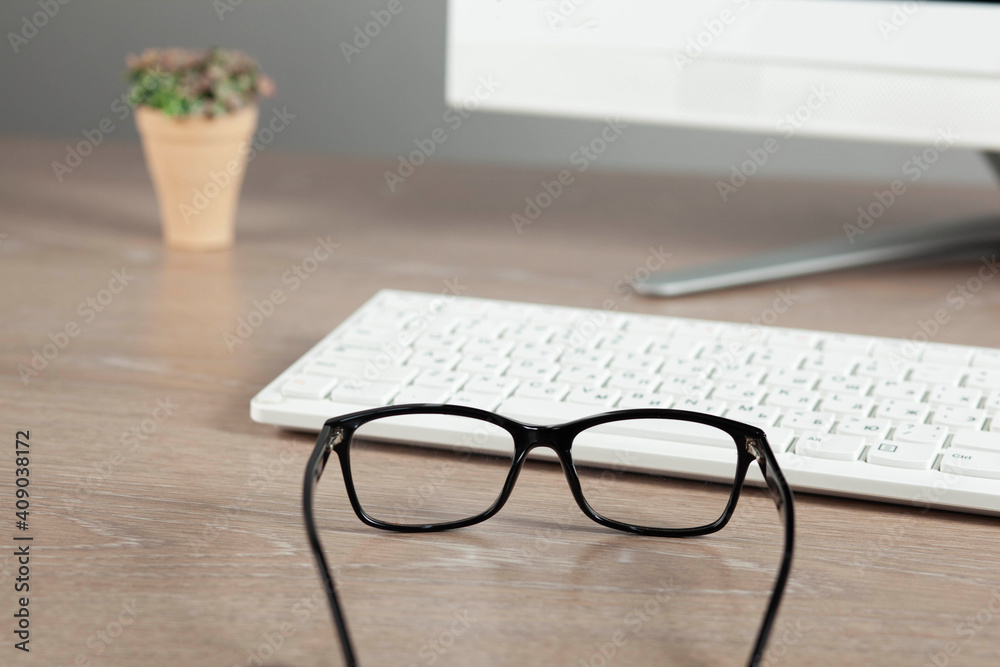 glasses on the computer keyboard glasses on the computer keyboard
