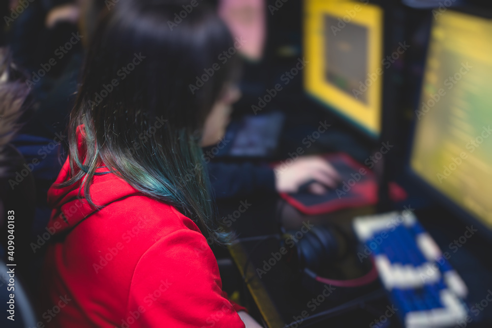 Female gamer, cyber sport e-sports tournament, professional girl gamers, close-up on gamer's hands on a keyboard, pushing button, in a cyber games arena club, girls playing and streaming fps game Female gamer, cyber sport e-sports tournament, professional girl gamers, close-up on gamer's hands on a keyboard, pushing button, in a cyber games arena club, girls playing and streaming fps game