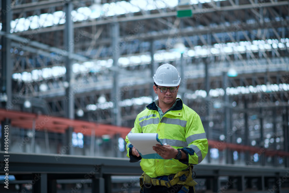 Worker in hand hold check sheet inspection job. Worker work in factory. Worker in hand hold check sheet inspection job. Worker work in factory.